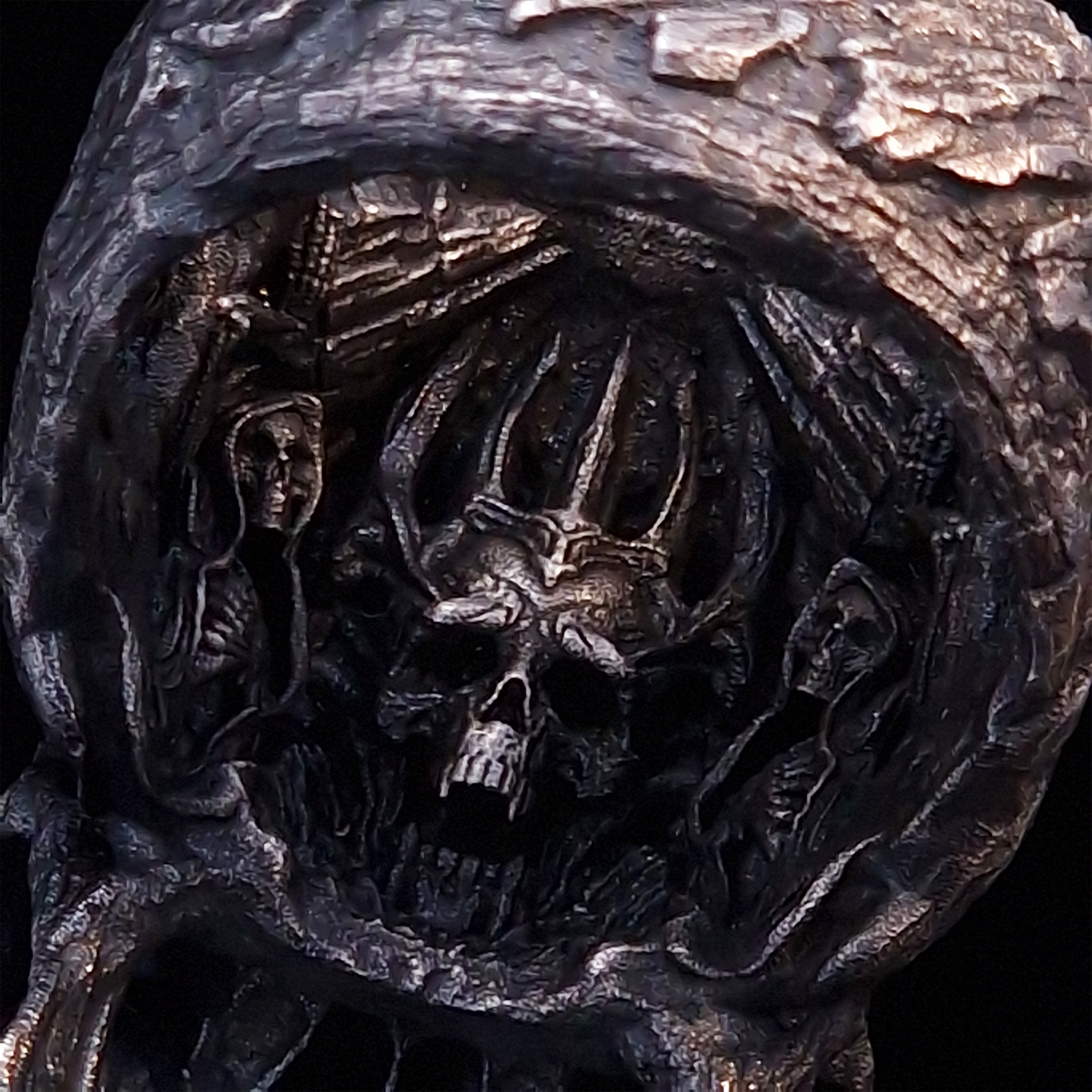 Close-up of the inner design of the Invidia Mortis ring in the Fallen finish, captured on a turntable with a black backdrop.