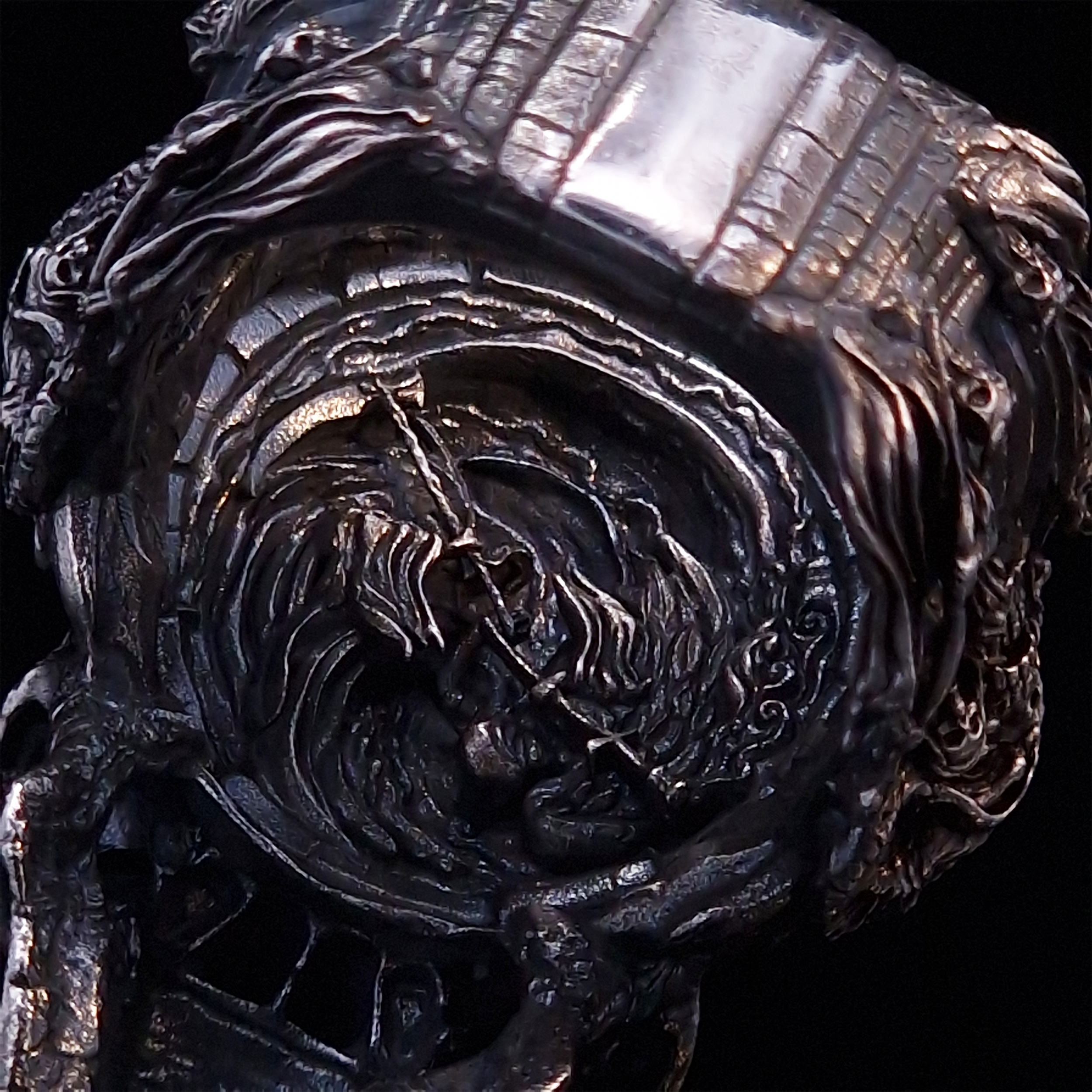 Close-up of the inner design of the Nexus Mortis ring in the Fallen finish, captured on a turntable with a black backdrop.