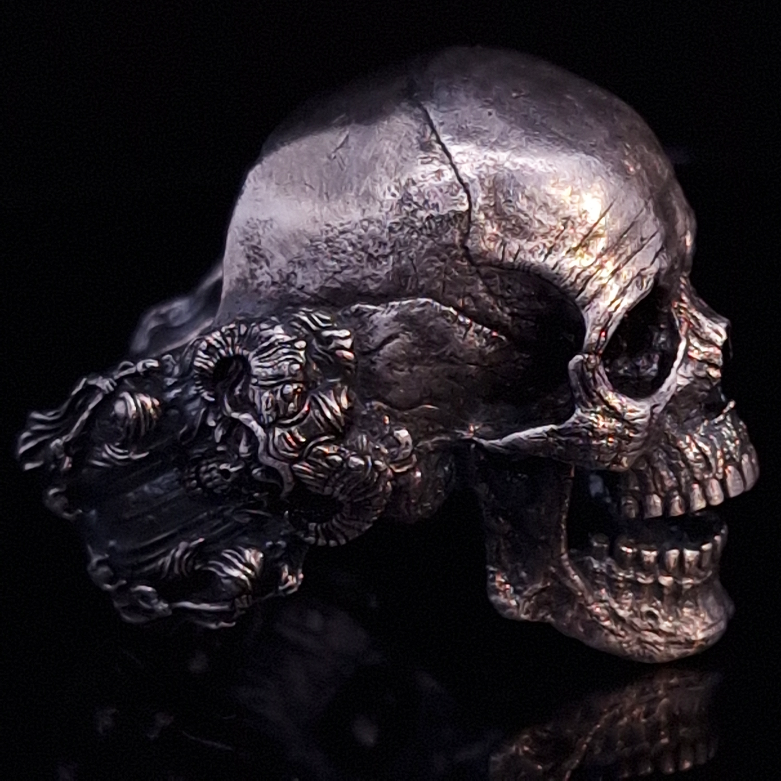 Side-right view highlighting the detailed band of the Nexus Mortis ring in the Fallen finish, shown on a turntable with a black background.