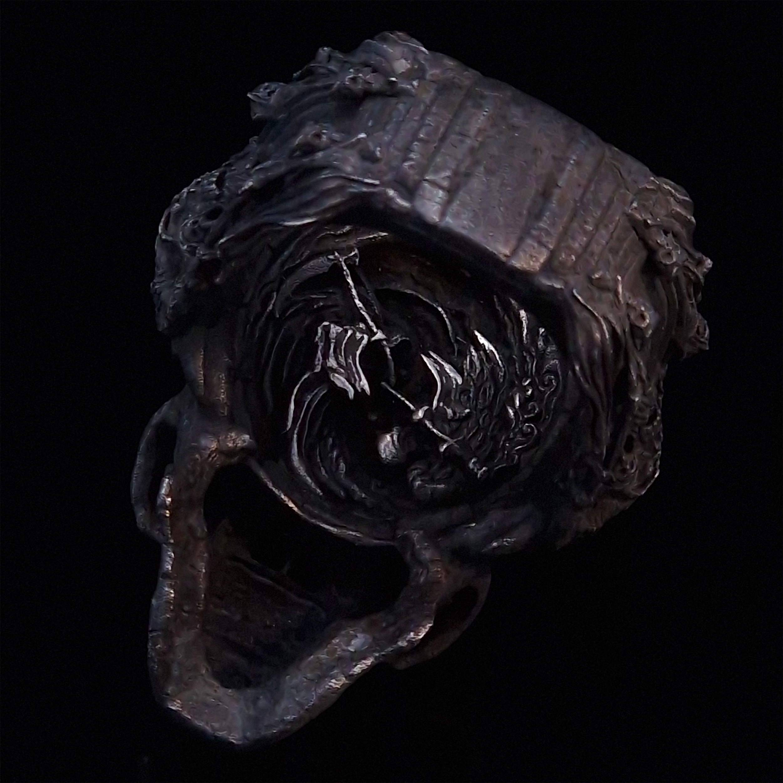 Back view of the Nexus Mortis ring in the Revenant 3 finish, captured on a turntable with a black backdrop.