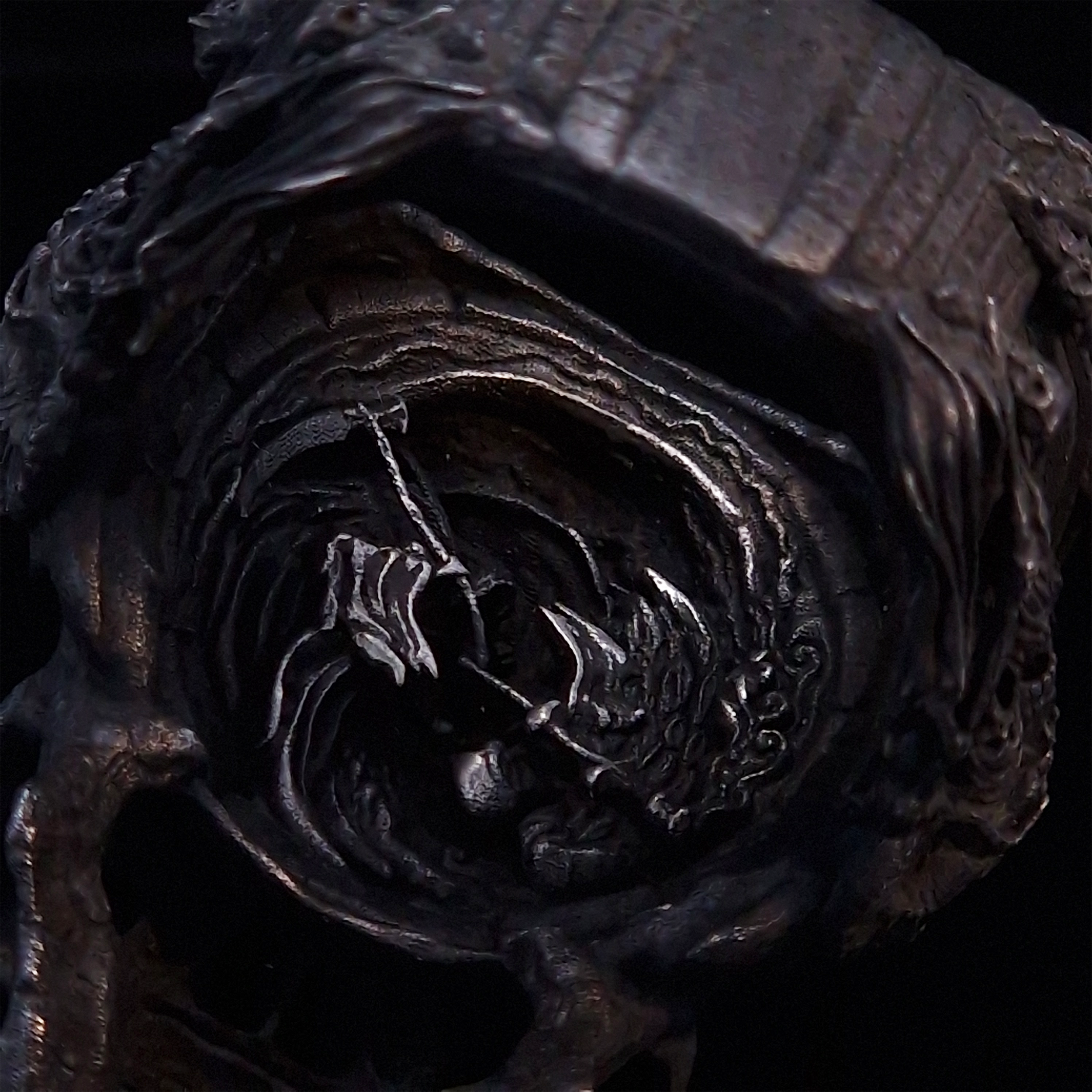 Close-up of the inner design of the Nexus Mortis ring in the Revenant 3 finish, captured on a turntable with a black backdrop.