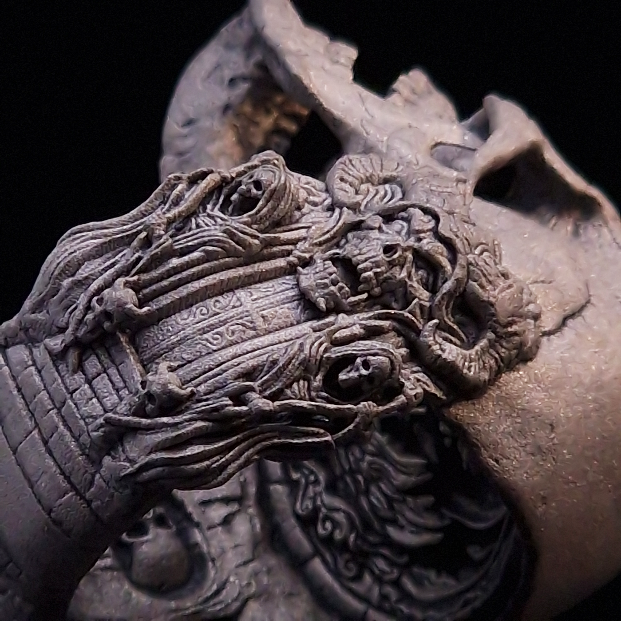 Close-up side view highlighting the detailed band of the Nexus Mortis ring in the Wraith finish, shown on a turntable with a black background.