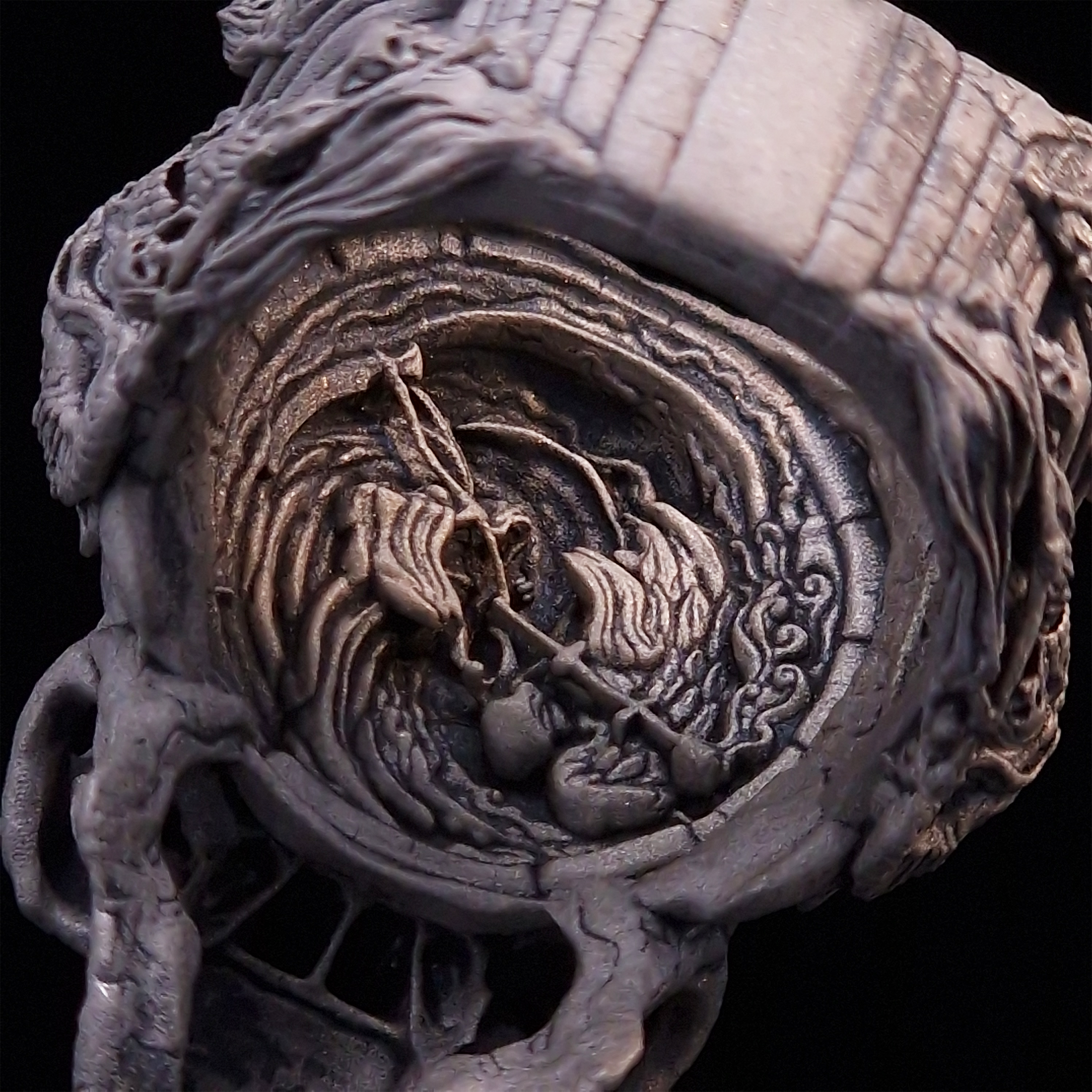 Close-up of the inner design of the Nexus Mortis ring in the Wraith finish, captured on a turntable with a black backdrop.