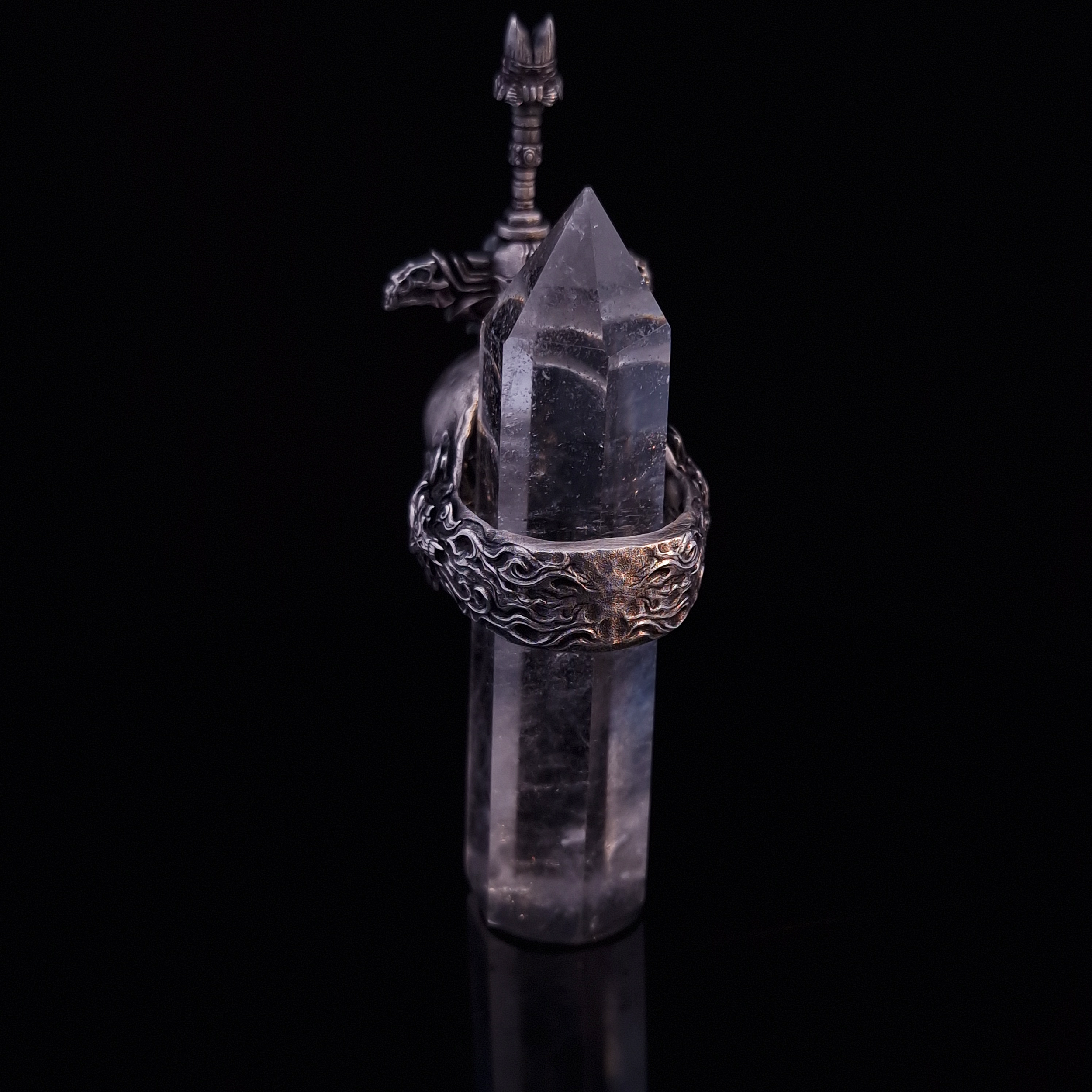 Rear view of the Adversarius Mortis ring in the Fallen finish, with crystal support visible, focusing on the intricate band design.