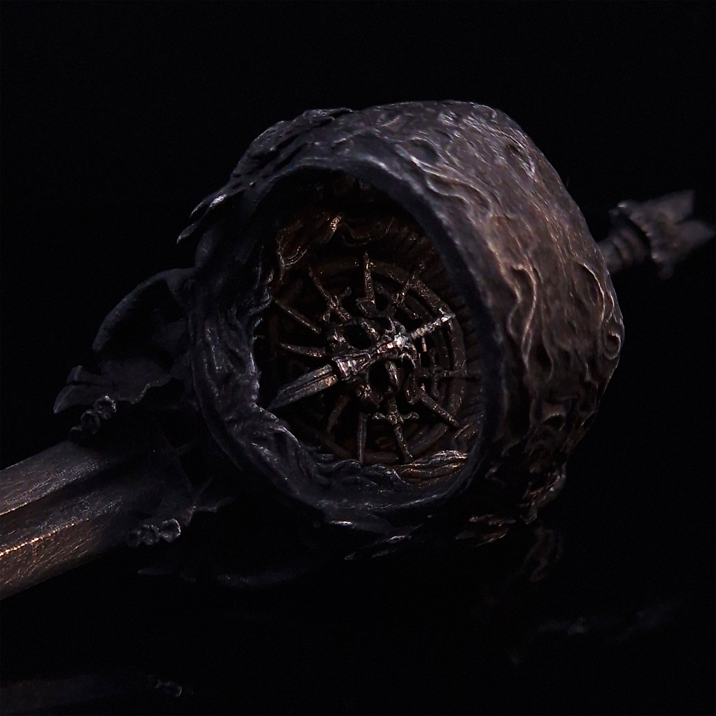 Rear view of the Adversarius Mortis ring in the Revenant 2 finish, focusing on the internal and back design, on a turntable with a black background.