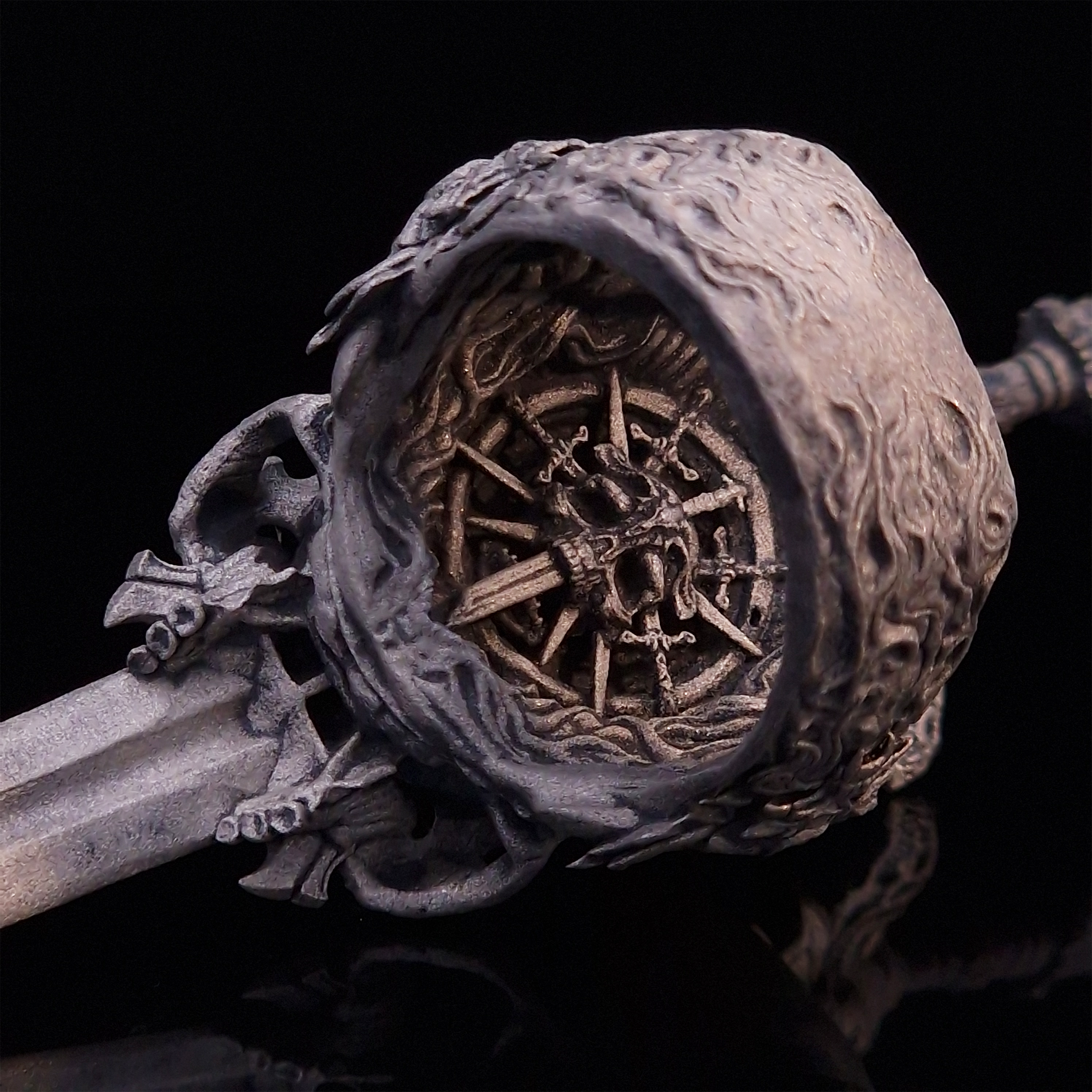 Rear view of the Adversarius Mortis ring in the Wraith finish, focusing on the internal and back design, on a turntable with a black background.