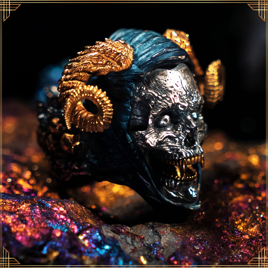 Close-up of the Eternal Sword of Damocles ring in focus, resting on an iridescent peacock ore stone that shimmers with vibrant colours against a blurred background