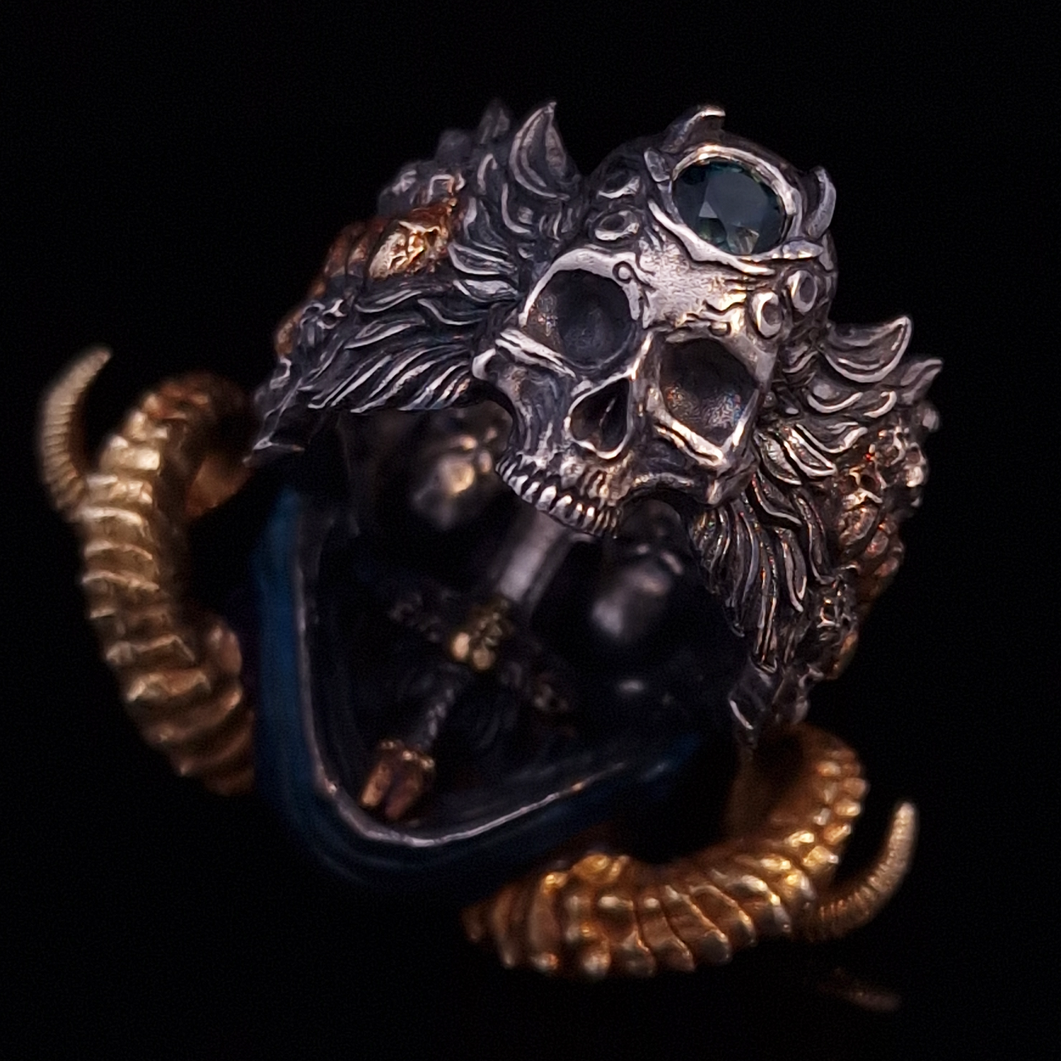 Back view of the Sword of Damocles ring in the Eternal finish, focusing on the gemstone detail, on a turntable with a black background.