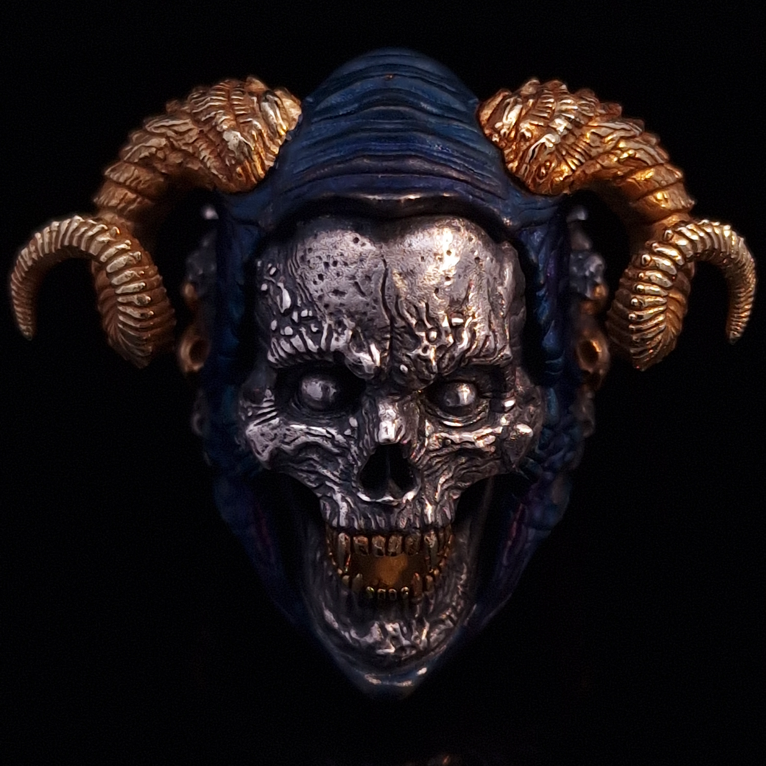 Front-facing view of the Sword of Damocles ring in the Eternal finish, displayed on a turntable against a black background.