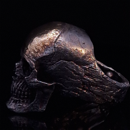 Side-left view highlighting the detailed band of the Invidia Mortis ring in the Revenant 1 finish, shown on a turntable with a black background.