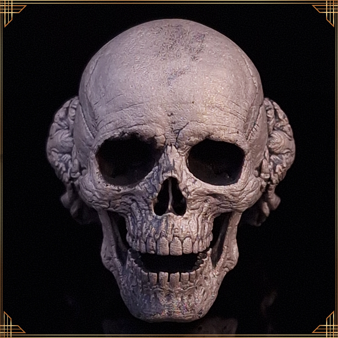 Front-facing close-up of the Nexus Mortis ring in the Wraith finish, against a black background with a gold border.