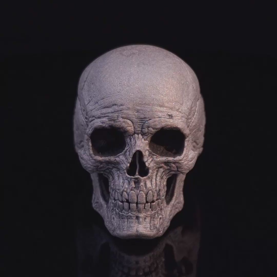 Video of the Invidia Mortis in the Wraith finish slowly rotating on a turntable, showcasing every angle against a black background.